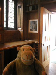 Mr Monkey looking at the fire door in the Map Room
