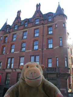 Mr Monkey looking up at No. 74 Princess Street