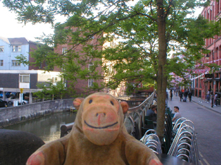 Mr Monkey looking along Canal Street from the Minshull Street bridge