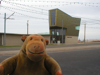 Mr Monkey looking across the road at the Festival House