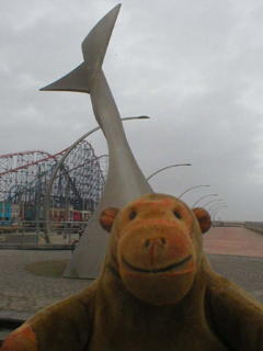 Mr Monkey looking at one of Ian McChesney's Swivelling Wind Shelters