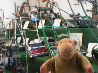 Mr Monkey looking at massed ranks of lawnmowers