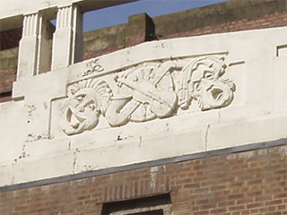 The comedy and tragedy masks on the colonnade of the Garrick