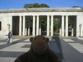 Mr Monkey looking at one of the memorial's colonnades