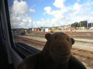 Mr Monkey looking out of the train as it approaches Blackpool station