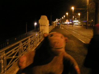 Mr Monkey looking at the promenade after the Illuminations have been switched off
