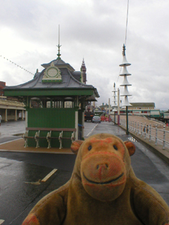 Mr Monkey trotting towards a shelter on the promenade