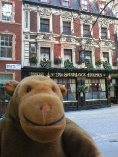 Mr Monkey in front of the Sherlock Holmes