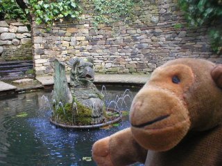 Mr Monkey with a griffin in a pond