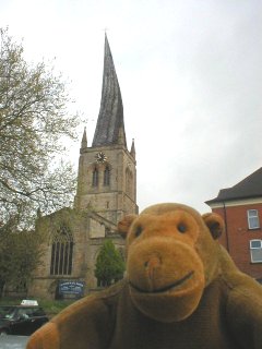 Mr Monkey in front Chesterfield's crooked spire