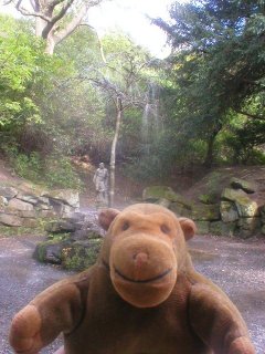 Mr Monkey in front a water squirting tree