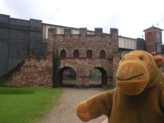 Mr Monkey outside a Roman gatehouse