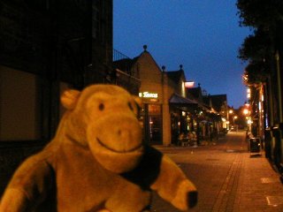 Mr Monkey in front of La Tascas' at night