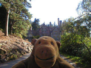 Mr Monkey approaching Cragside house
