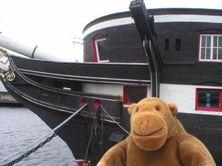 Mr Monkey by the bows of HMS Unicorn
