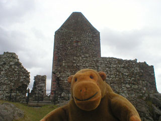 Mr Monkey approaching Smailholm Tower