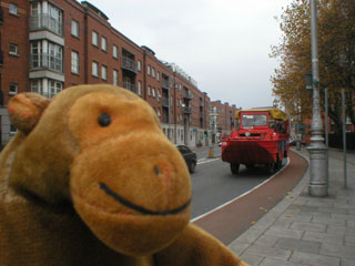 Mr Monkey watching an approaching DUKW in the street