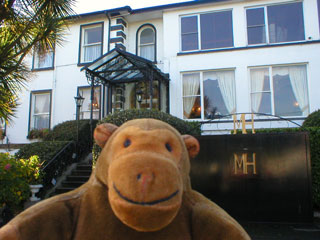 Mr Monkey outside his hotel