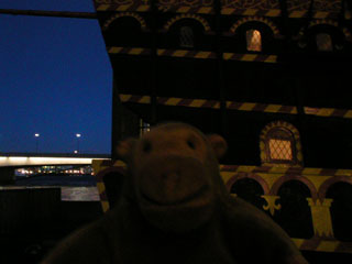 Mr Monkey in front of the rear castle of the Golden Hinde