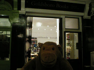 Mr Monkey in front of Goldsboro books