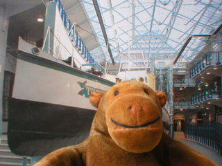 Mr Monkey in front of the Turbinia at the Discovery Centre