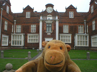 Mr Monkey outside the mansion