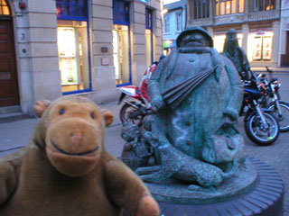 Mr Monkey beside the Grandma statue