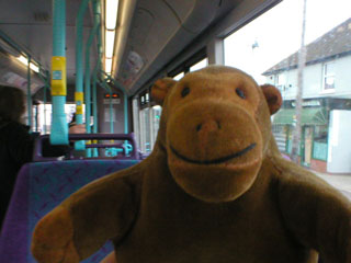Mr Monkey aboard a bus for Felixstowe