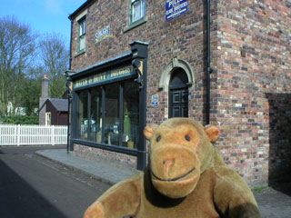 Mr Monkey outside the chemists