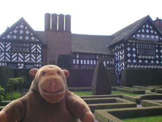 Mr Monkey looking at the back if Little Moreton Hall