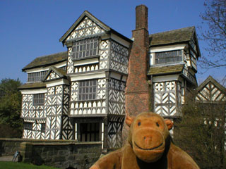 Mr Monkey in front of Little Moreton Hall