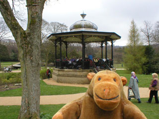 Mr Monkey in front of the Buxton bandstand