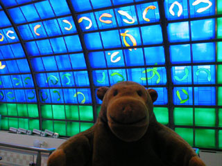 Mr Monkey under a blue stained glass roof
