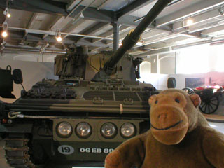 Mr Monkey in front of an Abbot self-propelled gun