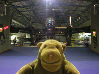 Mr Monkey in front of a Lancaster bomber