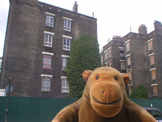 Mr Monkey in front of Stanley Buildings on Cheney Road