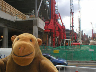 Mr Monkey looking across construction work to St Pancras Station