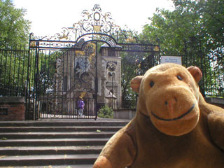 Mr Monkey outside the gates by St Pancras Old Church