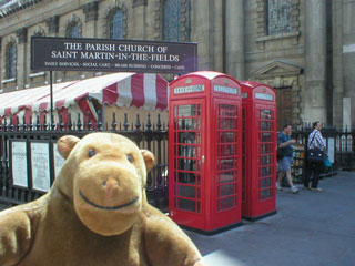 Mr Monkey with a pair of phoneboxes