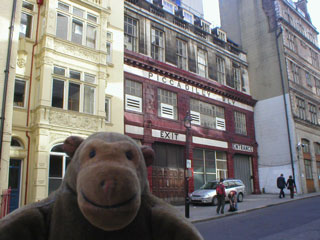 Mr Monkey outside a closed underground station