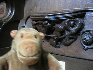 Mr Monkey examining an misericord