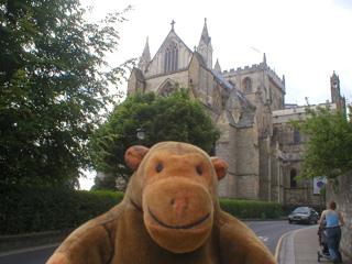 Mr Monkey walking away from the cathedral
