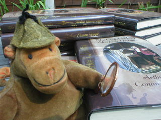 Mr Monkey examining some Sherlock Holmes books