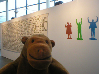 Mr Monkey in front of 'Art of Urban Warfare' by Influenza