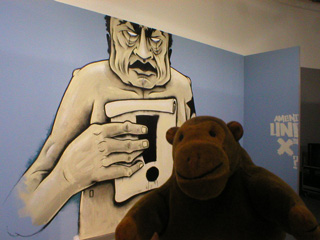 Mr Monkey in front of a piece by Dave Kinsey