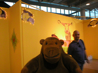 Mr Monkey approaching the Os Gemeos installation