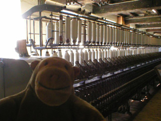 Mr Monkey in front of a spinning mule