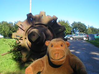 Mr Monkey examining a very large axle