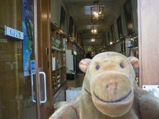 Mr Monkey leaving Twinings shop