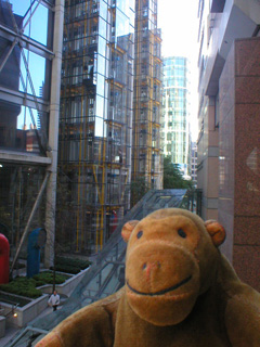 Mr Monkey examining the water wheel machinery